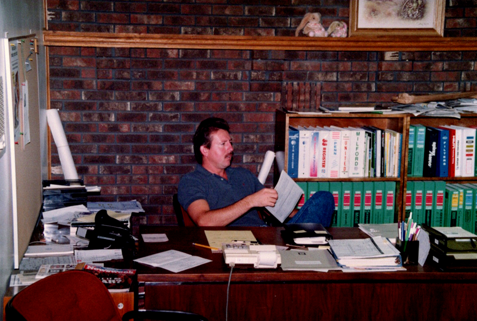 Founder Ernie Gibson at Lee Mechanical's first office in the family home
